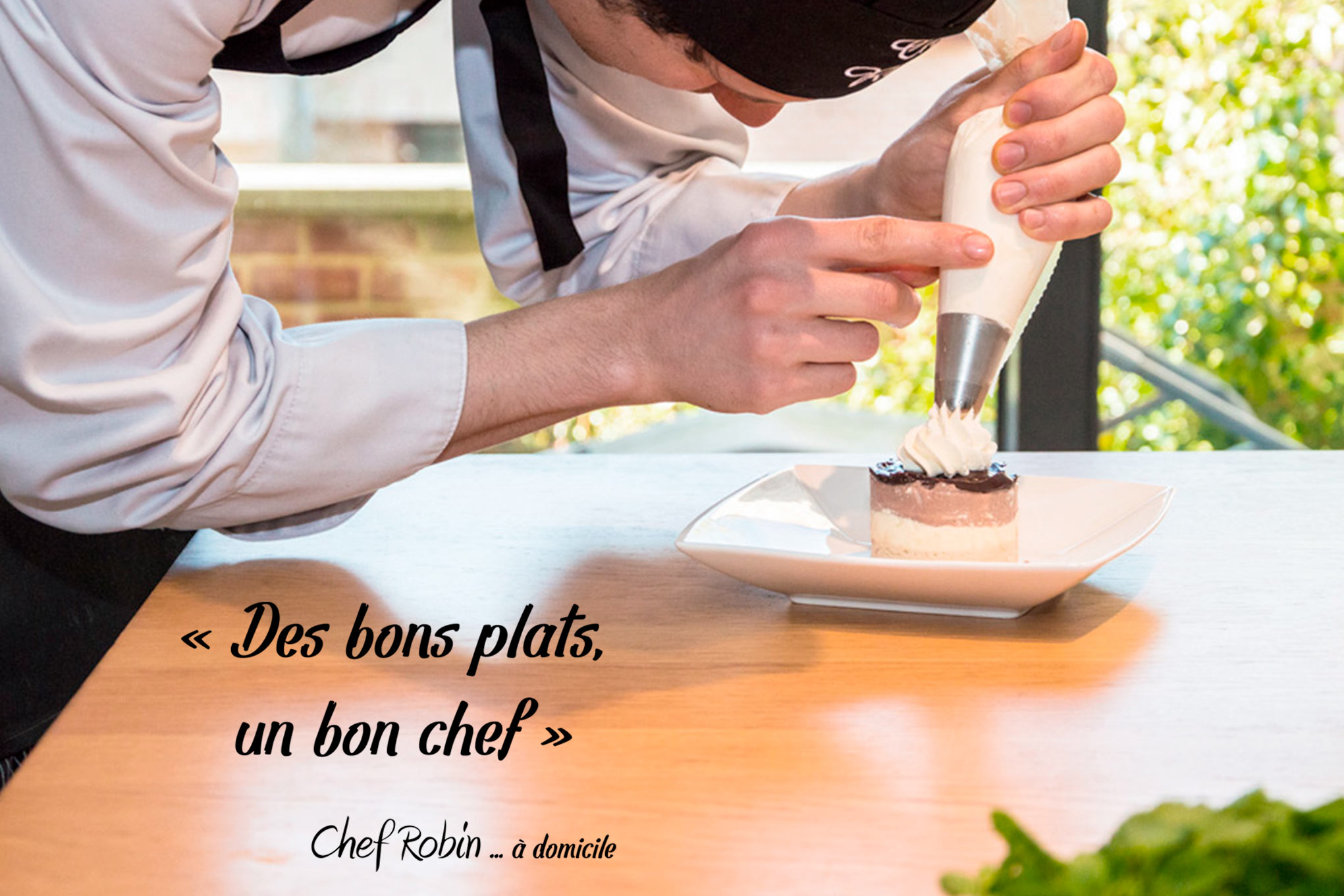 Chef adding sour cream on a cake